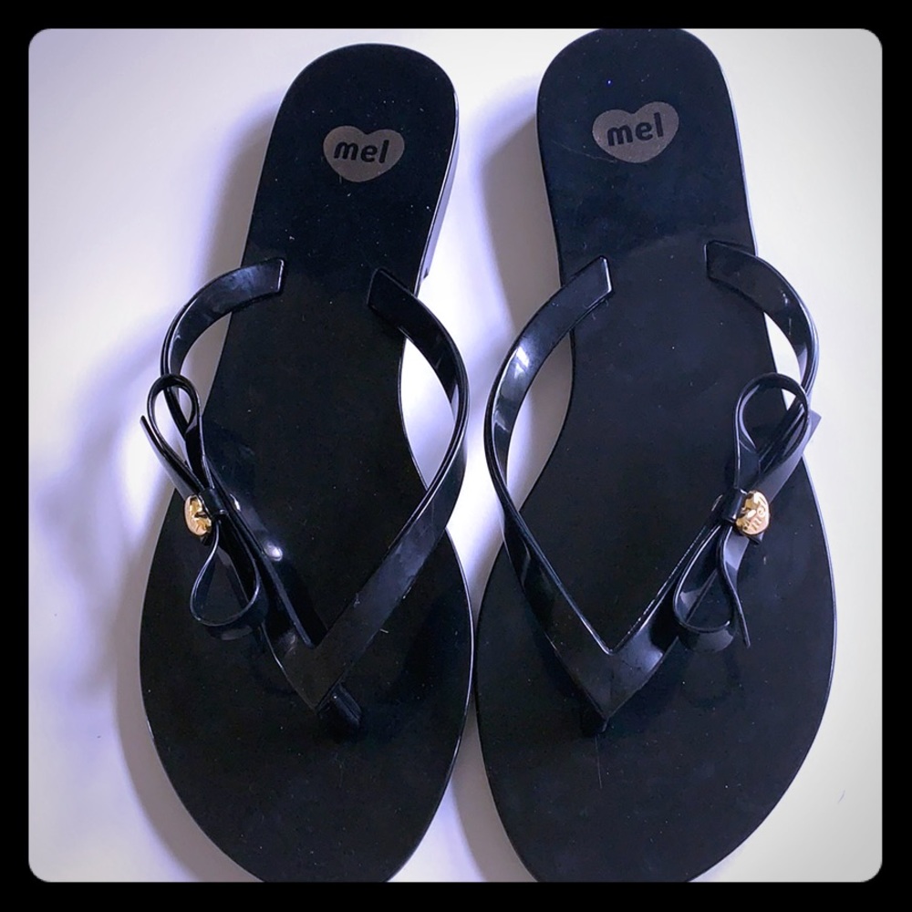 Black and gold Melissa Bow Flip Flops Size 7